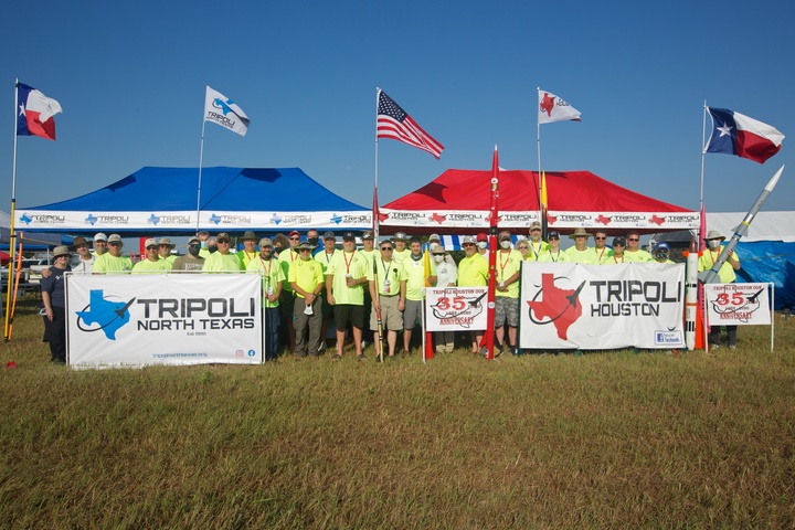 Model rocketry club team members launching high-powered rockets
