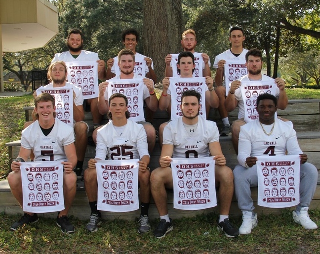 High school varsity football team wearing matching custom shirts for senior night on the field