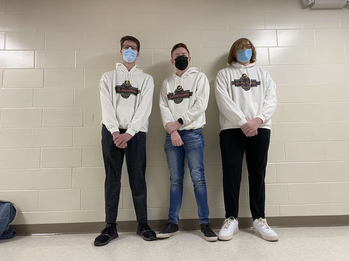 A small group of friends shares their matching custom sweatshirts.