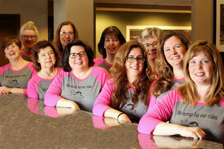 Women wearing matching scrapbooking shirts